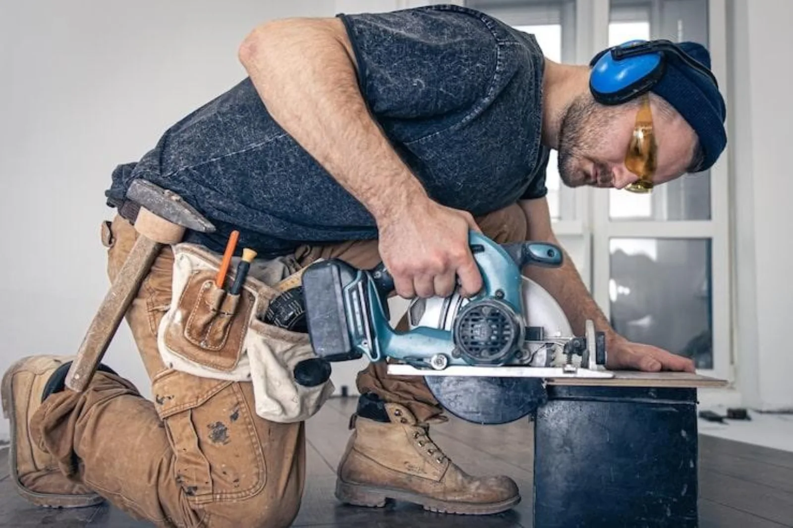 Dallas handyman using a circular saw to cut wood on a job site