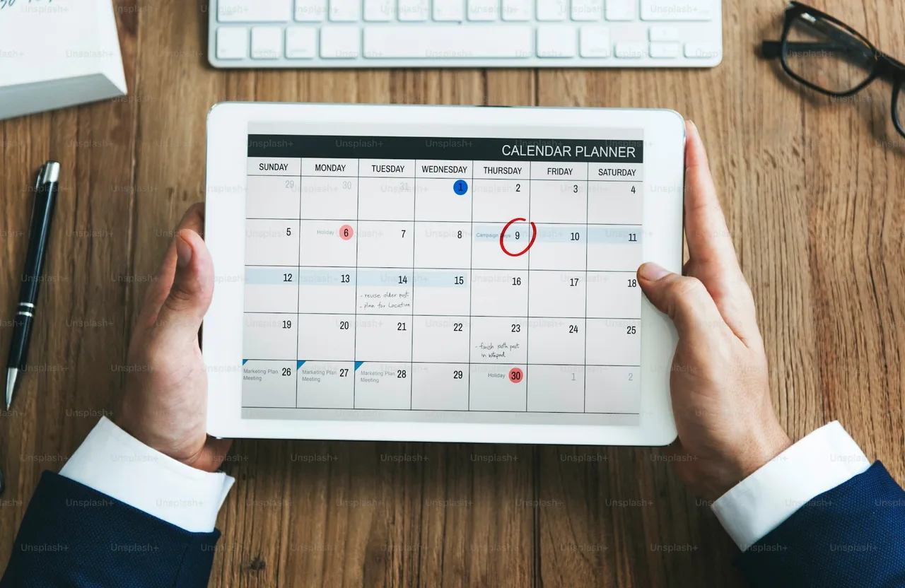 Handyman dispatch scheduling software calendar planner shown on a tablet